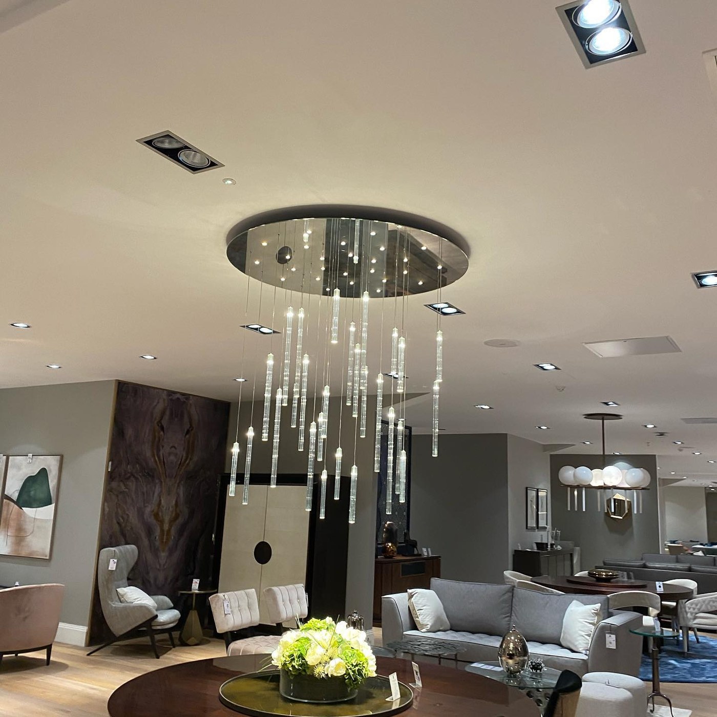 Crystal drop chandelier installed in a luxury showroom